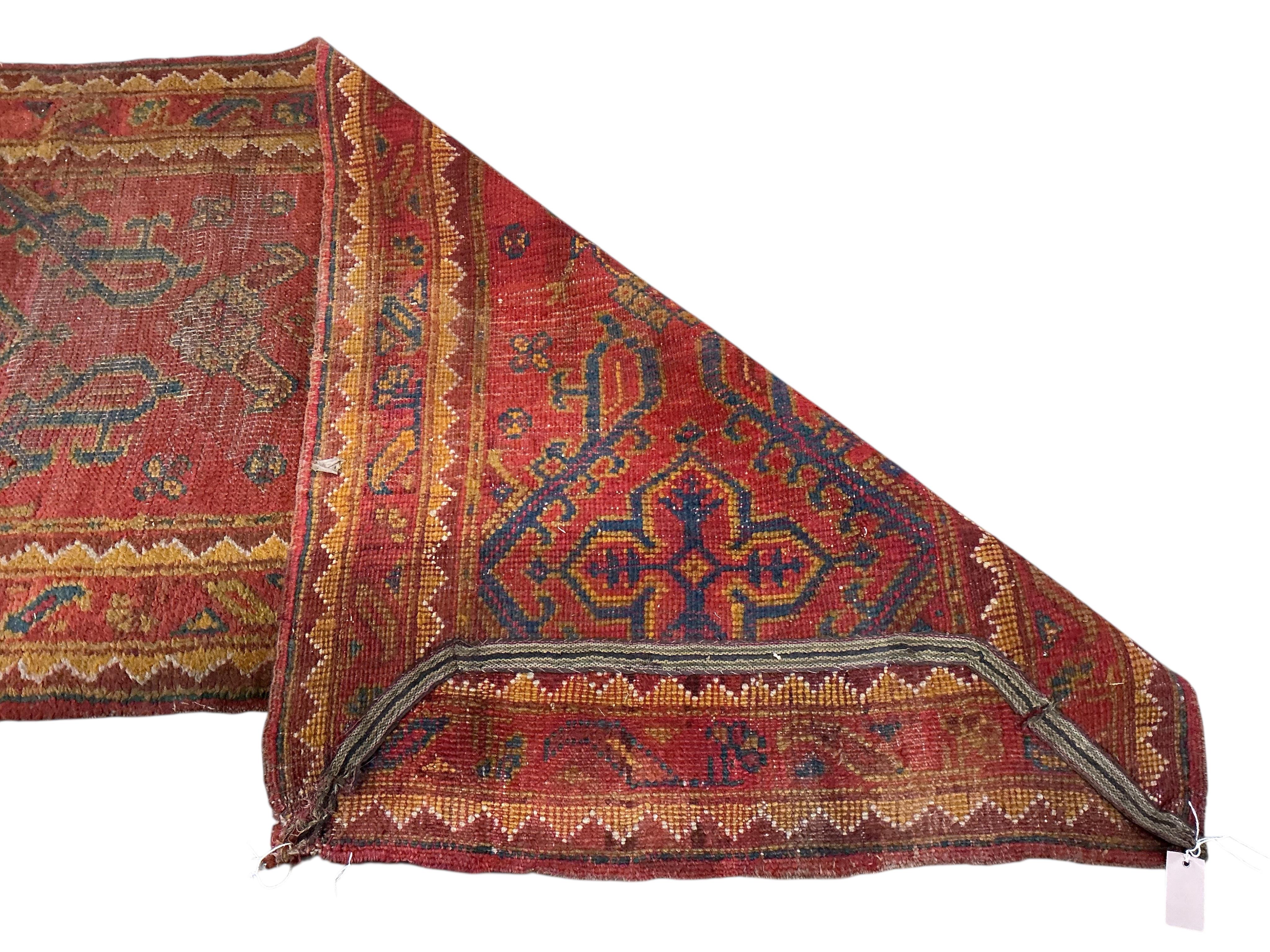 A Turkish Ousak runner, 396 x 96cm